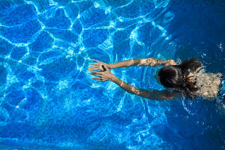 Woman in the poolの写真素材