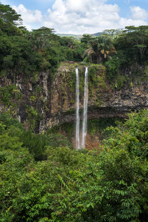 Waterfall flows into the crater of the volcano in National Park Chamarel, Mauritius.の写真素材