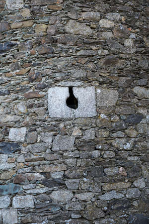 Loophole of a medieval castle. Stone wall. Spainのeditorial素材