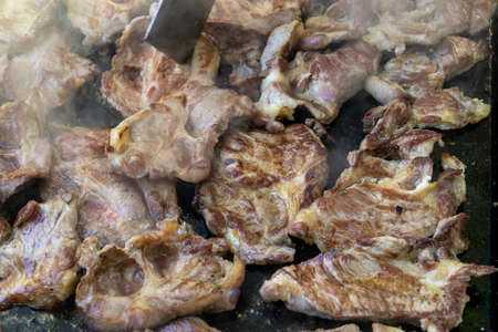 Close up of pork steaks during the grillの写真素材