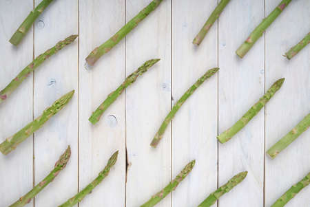 Top view of vegetables for posters and healthy food menus on white wooden background. Organic agricultural products. Vegan food. Veggies. Fresh vegetablesの写真素材