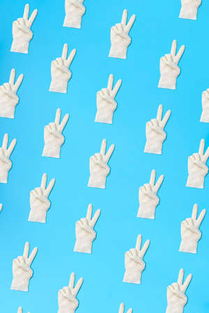 White latex gloves pattern. Protection concept. With proper protection you beat the virus.