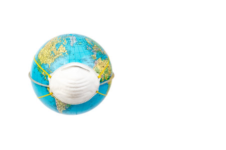 Planet earth wearing a protection medical mask. Concept of quarantine, protection from viruses and pandemic.の写真素材