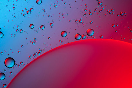 Blue and red bubbles. Abstract background. Bubble oil on water. Macro-photography.