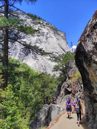 YOSEMITE NATIONAL PARK, CALIFORNIA, USA - JUNE 25, 2021: Crowds of hikers in Vernal Fall trail of Yosemite National Park. Wildlife at risk.のeditorial素材
