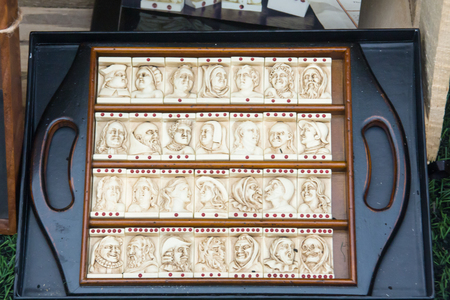 unusual domino game bones for a terrible and scary people with a wooden boardの写真素材