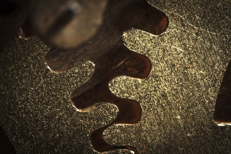 dark picture macro gear mechanism, in rusty dirty grunge style with shaded effect and dark corners and slight brightening textureの写真素材