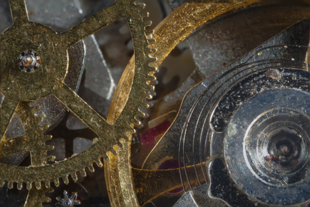clockwork gears from iron-based, macro close-up shot with dimming.の写真素材