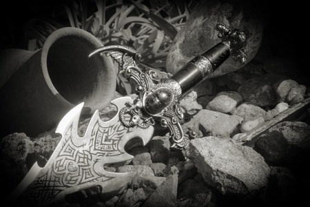 Photo of cold steel against the background of natural stones.の写真素材