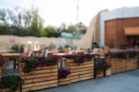 Blurred background with summer cafe tablesの写真素材