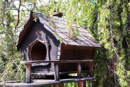 Wooden decorative house for animals in trees
