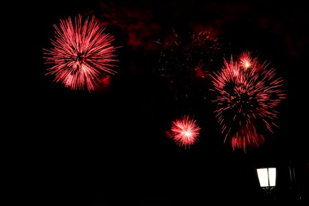 Fireworks, salute on a dark sky with a slight blur.の写真素材