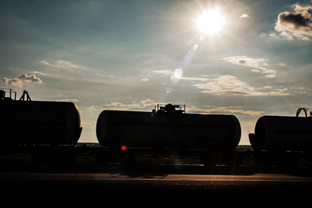 Railway tank on the background of the sky and the sun.の写真素材