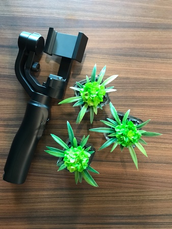 Three axis gimbal on the wooden table topの素材