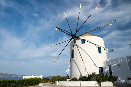 Windmill view during hot summer day on Antiparos island in Cyclades in Greece, 2019