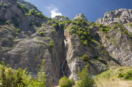 Tzoumerka national park mountains and a waterfall Kefalovriso - higherst waterfall in Greece with 350mの写真素材