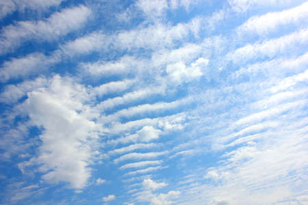 The blue sky and clouds in a summer dayの写真素材