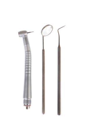 Dental mirror, dental sonde and turbine. Image isolated on white backgroundの写真素材