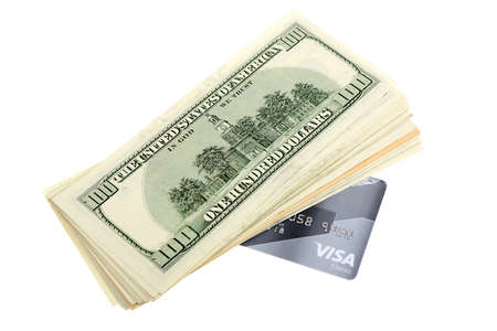 Stack of US dollars banknotes and credit card. Image isolated on white backgroundの写真素材