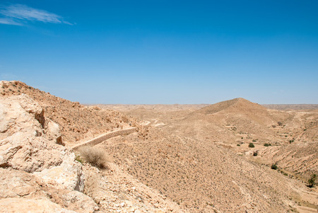 Destroyed long stone walls in the desertの写真素材