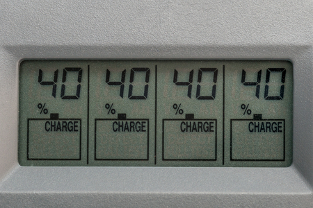 Liquid crystal display charger for batteries with charge number in percent close-up