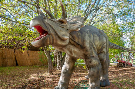 Russia, Moscow - September 29, 2018: Dinosaur in the park in sunny weatherのeditorial素材