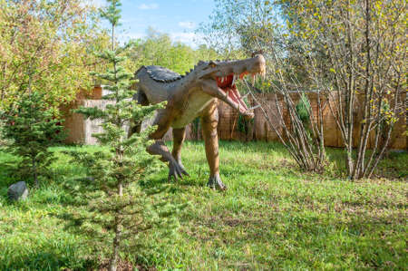 Russia, Moscow - September 29, 2018: Dinosaur in the park in sunny weatherのeditorial素材