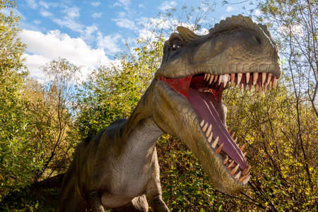 Russia, Moscow - September 29, 2018: Dinosaur in the park in sunny weatherのeditorial素材