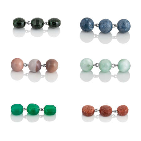 A set of natural gemstones and beads for jewelry and bijouterie. Template for designers and layouts. Isolated on white with reflectionの写真素材
