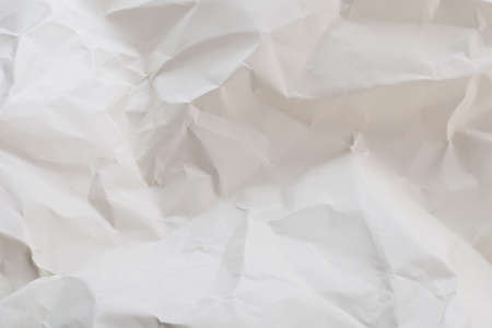White or light gray crumpled paper with soft texture backgroundの写真素材