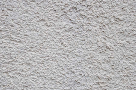 Plastered light wall. Background with irregular patches in the form of an asymmetrical patternの写真素材