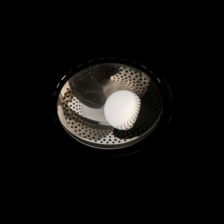 Dim LED bulb in the dark to save electricityの写真素材