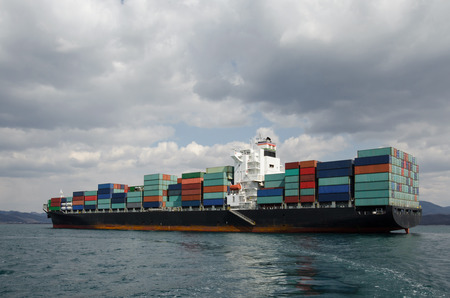 Vessel standing near port on an anchorの写真素材