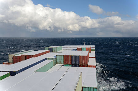 Vessel going through waves on the oceanの写真素材