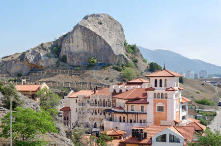 Sudak, Crimea - August 13: Large house against the rock on August 13, 2015  in Sudak, Crimea.
