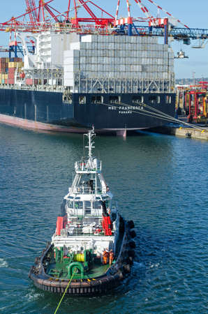 Durban, South Africa - February 04: Tugboat  during mooring operation in port of Durban on February 04, 2016  in Durban, South Africa.のeditorial素材