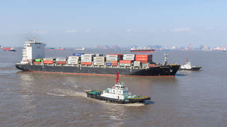 Shanghai, China - December 24: Vessel moor to the berth in port of Shanghai on December 24, 2018 in Shanghai, China.のeditorial素材