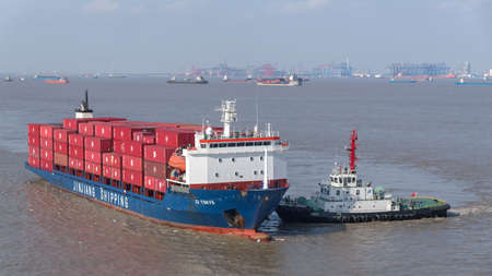 Shanghai, China - December 24: Vessel moor to the berth in port of Shanghai on December 24, 2018 in...