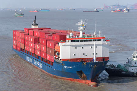 Shanghai, China - December 24: Vessel moor to the berth in port of Shanghai on December 24, 2018 in Shanghai, China.のeditorial素材