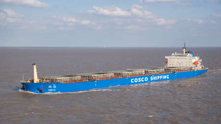 Shanghai, China - November 13: Bulk carrier going along the coast on November 13, 2018 in Shanghai, China.のeditorial素材