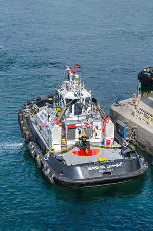 Jebel Ali, United Arab Emirates - January 05: Tugboat on the berth in port of Jebel Ali on January 05, 2018  in Jebel Ali, United Arab Emirates.のeditorial素材