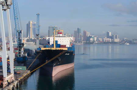 Dar es Salaam, Tanzania - February 21: Container terminal and city landscape in port of Dar es Salaam on February 21, 2018 in Dar es Salaam, Tanzania.のeditorial素材