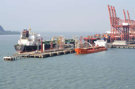 Nhava Sheva, India - March 09: Three cargo vessels in the port of Nhava Sheva on March 09, 2018 in Nhava Sheva, India.のeditorial素材