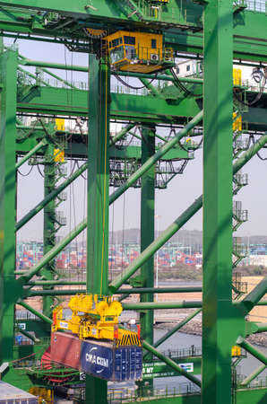 Nhava Sheva, India - March 09: Cargo crane of the container terminal in port of Nhava Sheva on March 09, 2018 in Nhava Sheva, India.のeditorial素材