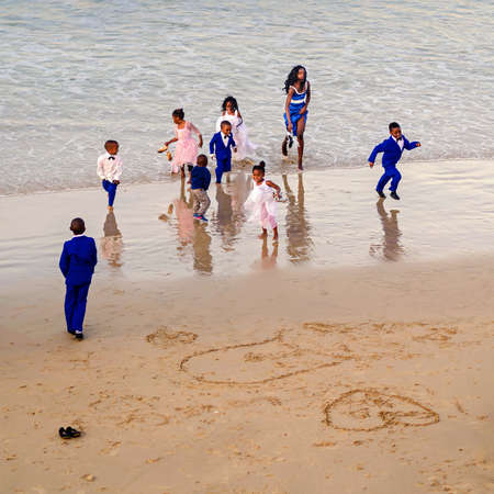 Port Elizabet, South Africa - September 12: Happy kids on the beach in the Port Elizabet on September 12, 2015 in Port Elizabet, South Africa.のeditorial素材