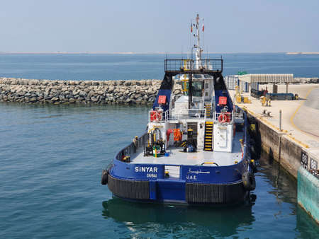 Jebel Ali, United Arab Emirates - October 09: Tugboat on the berth in port of Jebel Ali on October 09, 2021 in Jebel Ali, United Arab Emirates.のeditorial素材