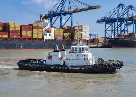 Mundra, India - October 6: Tugboat in port of Mundra on October 06, 2021 in Mundra, India.のeditorial素材