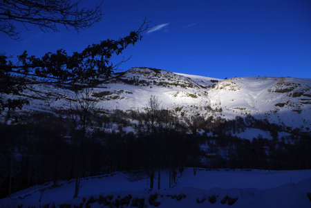 Light game in the snowy mountains of Espinosa de los Monterosの写真素材