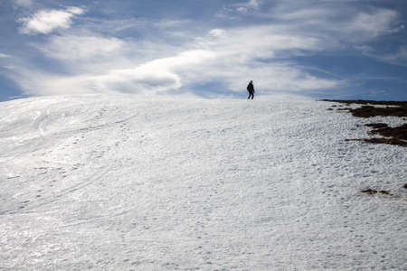 Ascent to Pico de la Miel in the Cantabrian Mountains, Espinosa de los Monteros -Burgos Spain, snowshoeing on a sunny snowy day.の写真素材