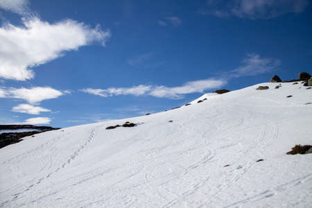 Ascent to Pico de la Miel in the Cantabrian Mountains, Espinosa de los Monteros -Burgos Spain, snowshoeing on a sunny snowy day.の写真素材